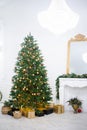 Festive interior with decorated Christmas tree and fireplace Royalty Free Stock Photo