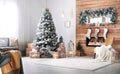 Interior with decorated Christmas tree and fireplace Royalty Free Stock Photo