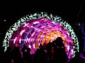 Festive light tonnel with silhouettes of people Royalty Free Stock Photo