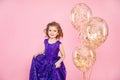 Festive little girl with balloons