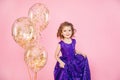 Festive little girl with balloons