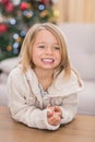 Festive little girl smiling at coffee table