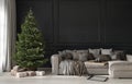 Festive living room with a beige cozy sofa and a Christmas tree with gifts Royalty Free Stock Photo