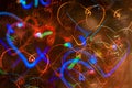 Festive long exposure lights background with hearts. St. Valentine day. Royalty Free Stock Photo