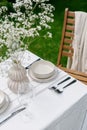 Table setting with dishware and silverware outdoors Royalty Free Stock Photo