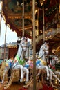 Festive merry-go-round carousel with horses and lights in Frankfurt during the Christmas market, Christmas holiday Royalty Free Stock Photo