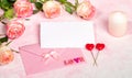 Festive mock up with roses, envelope, empty blank sheet, candle, hearts, letters LOVE. Copy space.