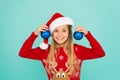 Festive mood. Decorative accessories. Decorating christmas tree. Girl smiling face hold balls blue background. Let kid Royalty Free Stock Photo