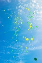 Festive multi-colored balloons in the blue sky Royalty Free Stock Photo