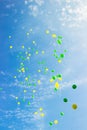 Festive multi-colored balloons in the blue sky Royalty Free Stock Photo