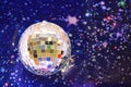 Festive multi-colored shiny ball with mosaic from pieces of a mirror