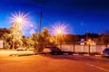 Evening, cozy corner for cars, multi-beam lights. Royalty Free Stock Photo