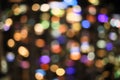 Festive multicolored city holiday lights blurred defocused bokeh balls of city downtown