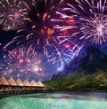 Festive New Year`s fireworks over the tropical island Royalty Free Stock Photo