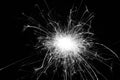 Festive New Year`s single sparkling burning sparkler on a black background. Black and white. Holiday concept Royalty Free Stock Photo