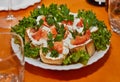 Festive New Year's Table Setting with Cheese Baskets, Fresh Salmon, and Greens