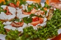 Festive New Year's Table Setting with Cheese Baskets, Fresh Salmon, and Greens