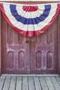 Antique doors with patriotic banner