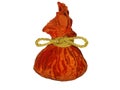 Festive orange colored gift bag tied with gold rope isolated on white background