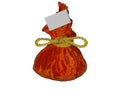 Festive orange colored gift bag tied with gold rope isolated on white background