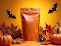 Festive packaging with Halloween decorations on an orange backdrop Royalty Free Stock Photo