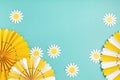 Festive party background with yellow paper circle fans over blue pastel background