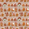 Festive pattern with decorated gingerbread houses, intermingled with Christmas trees, sweets and snowflakes on beige Royalty Free Stock Photo