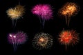 Festive patterned of Colorful assorted firework bursting in various shapes sparkling pictograms set against black background Royalty Free Stock Photo