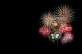 Festive patterned of Colorful assorted firework bursting in various shapes sparkling pictograms set against black background Royalty Free Stock Photo