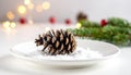 Festive Pinecone in Snow with Bokeh Lights Royalty Free Stock Photo