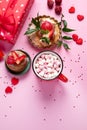 Festive pink background with cupcake, strawberries, chocolates, hot drink. Birthday celebration Royalty Free Stock Photo