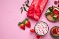 Festive pink background with cupcake, strawberries, chocolates, hot drink. Birthday celebration Royalty Free Stock Photo