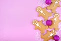 Festive pink theme Christmas holiday background with gingerbread Royalty Free Stock Photo