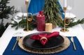 Festive place setting with beautiful dishware, cutlery and fabric napkin for Christmas dinner on white table Royalty Free Stock Photo