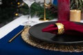 Festive place setting with beautiful dishware, cutlery and fabric napkin for Christmas dinner on white table, closeup Royalty Free Stock Photo