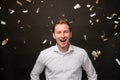 Festive portrait amused man smiling confetti rain