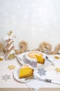 Festive pumpkin cake with coconut on table and Christmas decoration. Background bokeh