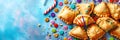 Festive Purim background, Purim attributes, triangular pies, Haman ears, traditional hamantaschen cookies. Banner on a