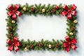 A festive rectangular frame adorned with evergreen branches red bows golden ornaments and pinecones for holiday greetings winter Royalty Free Stock Photo