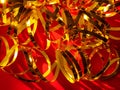 Festive red background.Golden shimmerring shiny ribbons texture glowing decorations backdrop.Holidays New year Christmas Royalty Free Stock Photo