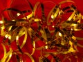 Festive red background greeting card Golden shimmerring shiny ribbon texture glowing decoration backdropHoliday New year Royalty Free Stock Photo