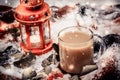Festive red candle in lantern and mug of coffee on rug with snow Royalty Free Stock Photo