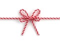 Festive Red and White Striped Twine Bow with Twisted Texture Royalty Free Stock Photo