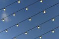 Festive retro garland against the evening sky. Wedding, celebration, event concept.