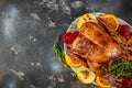 Festive roast duck with apples on a dark background. top view. copy space for text