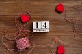 Festive romantic background on a wooden table. Concept for Valentine`s day with hearts and place for text Royalty Free Stock Photo