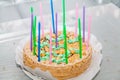 Festive round cake with high candles Royalty Free Stock Photo