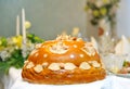 Festive round loaf bread on table .