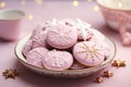 Festive round-shaped Christmas cookies with pink glaze and ornament