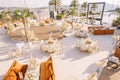 Festive round tables with chairs stand on the pool deck. Top view